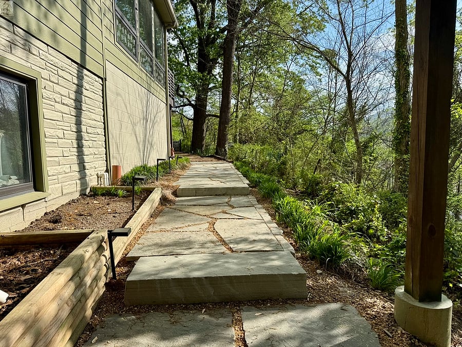 Walkway between the driveway and the apartment.
