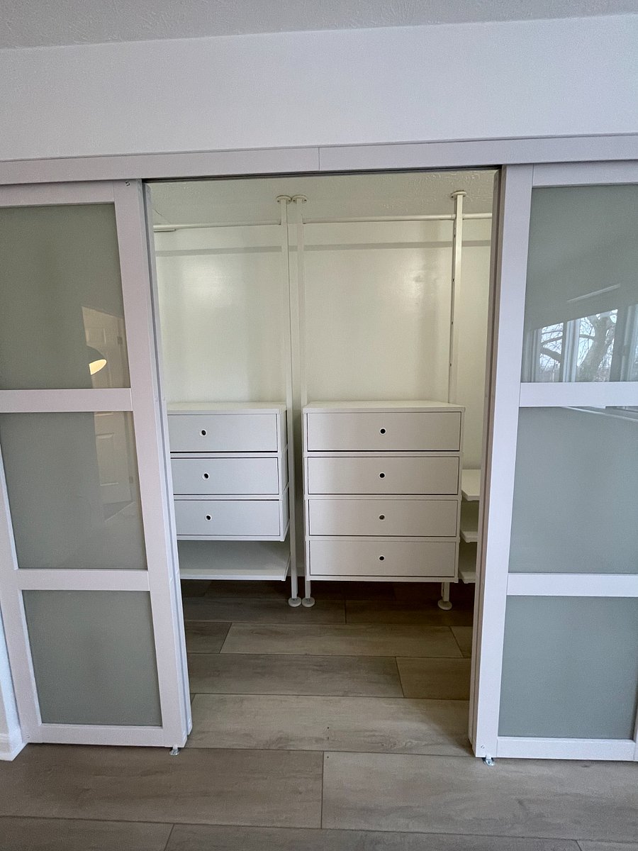 Primary bedroom large walk-in closet featuring an IKEA ELVARLI closet system, 8 spacious drawers, and plenty of hanging space.