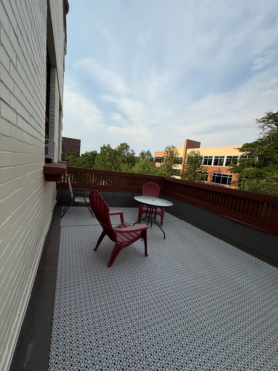 2nd floor shared community balcony with city views