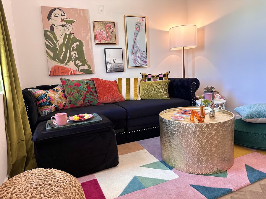 Colorful living area with a plush sectional that converts into a king-size memory-foam sleeper. Guests often love leaving it open for extra lounging, with plenty of room to relax even when fully extended.