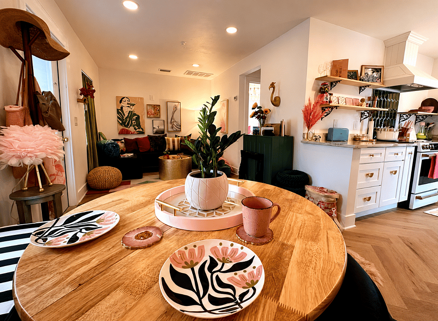 View of the main living space from the cozy dining nook: an inviting spot to enjoy morning coffee, linger over breakfast, or settle in for a productive remote work day.