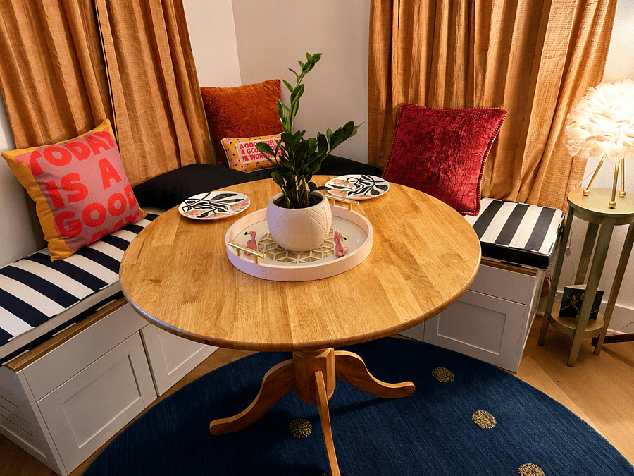 Built-in banquet seating with convenient under-bench storage and comfortable seating for four, making it the perfect spot for meals, games, or planning your next beach day.