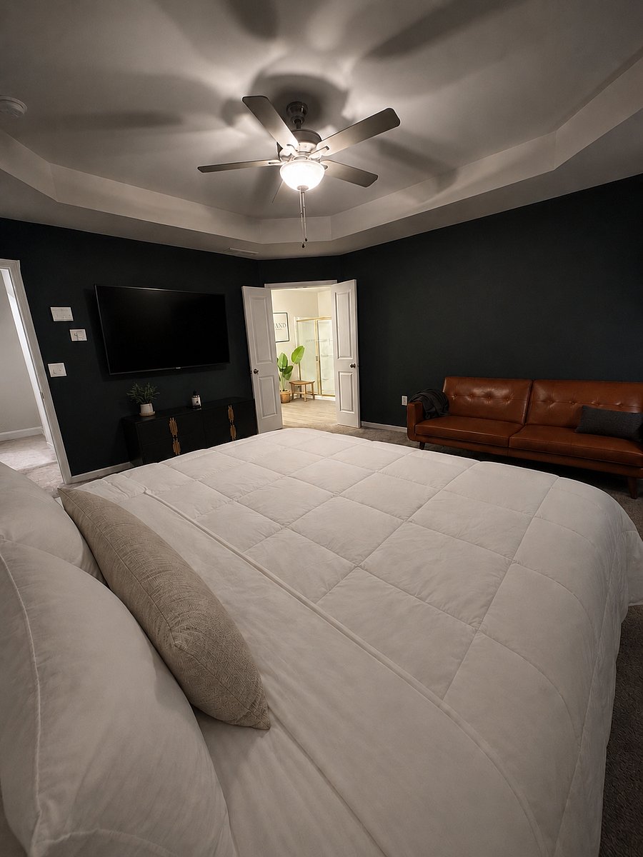 Master bedroom features a full sized futon, smart tv, full bathroom with walk in shower and walk-in closet for the ultimate privacy.