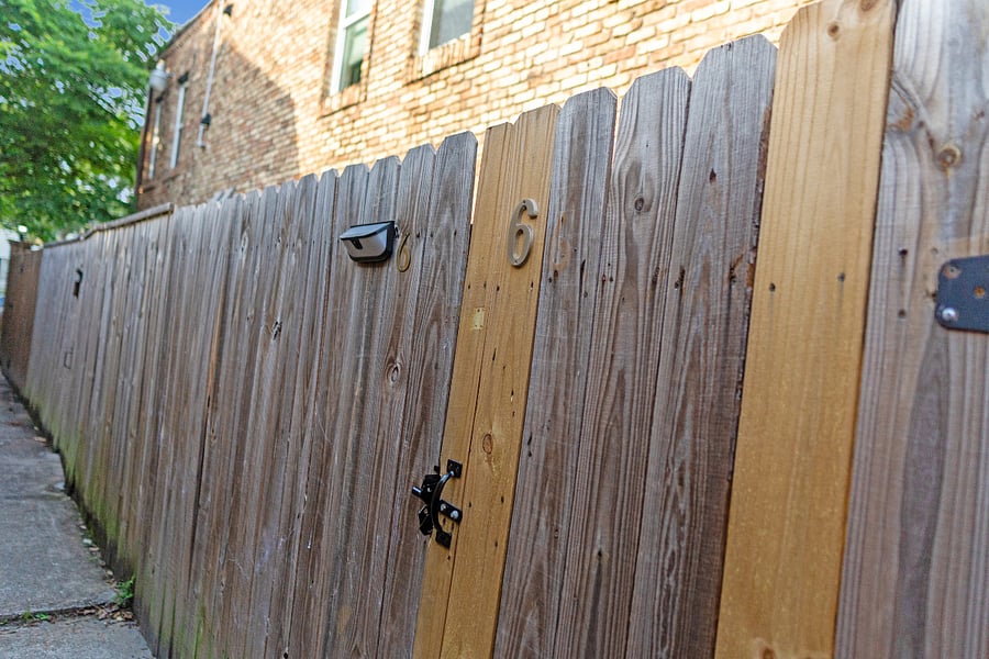 You will see # 6 on the fence. Please enter & you will find the outdoor patio & front door.