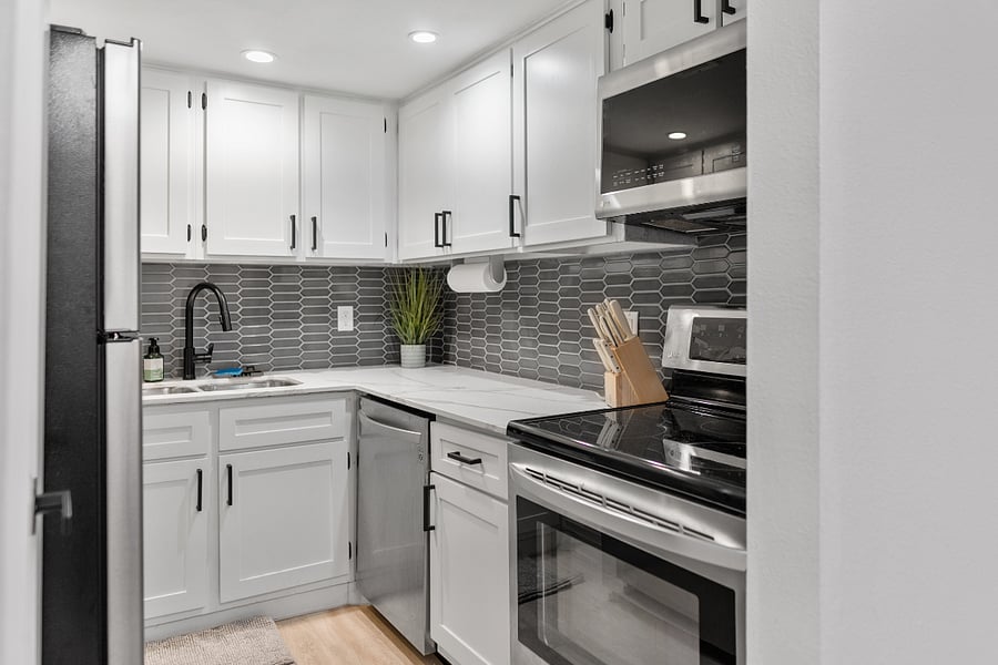 New backsplash & stainless appliances make for a fresh & beautiful look in the kitchen.