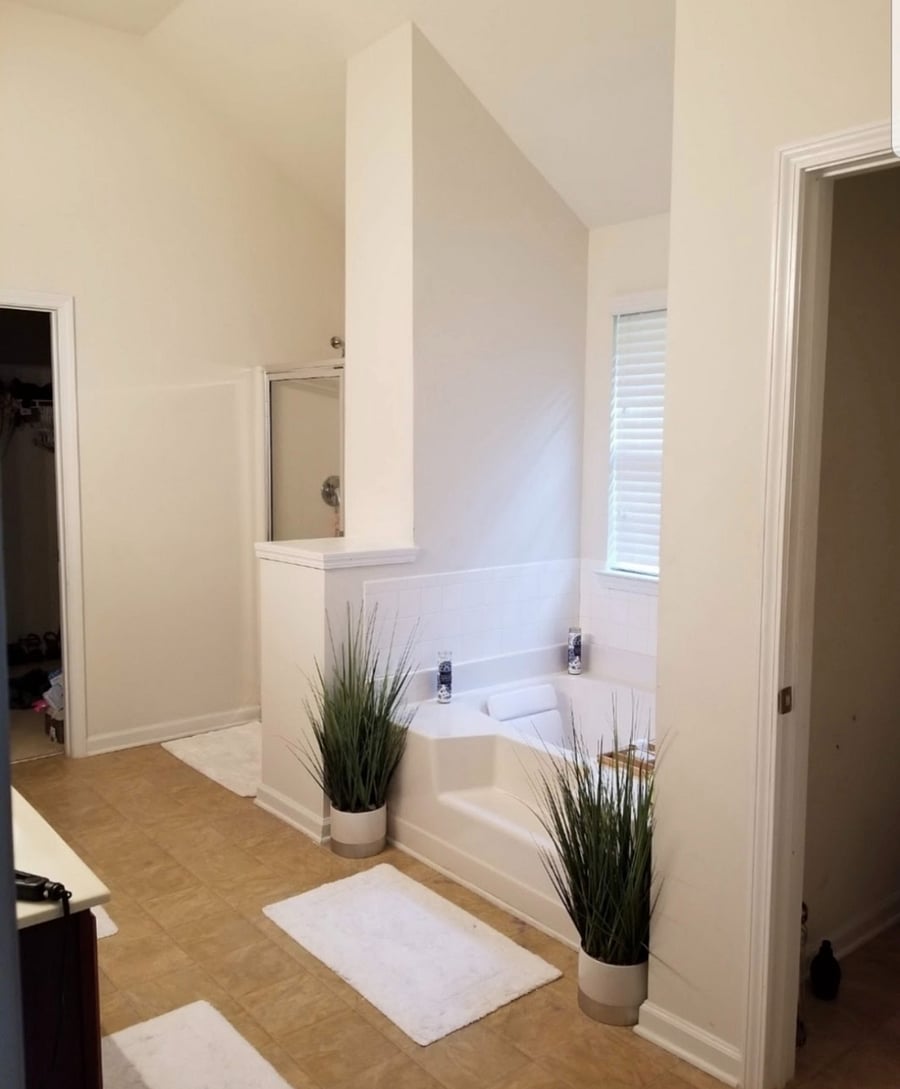 Primary Bathroom featuring a deep soaking tub, separate walk-in shower, private water closet, and 2 spacious walk-in closets
