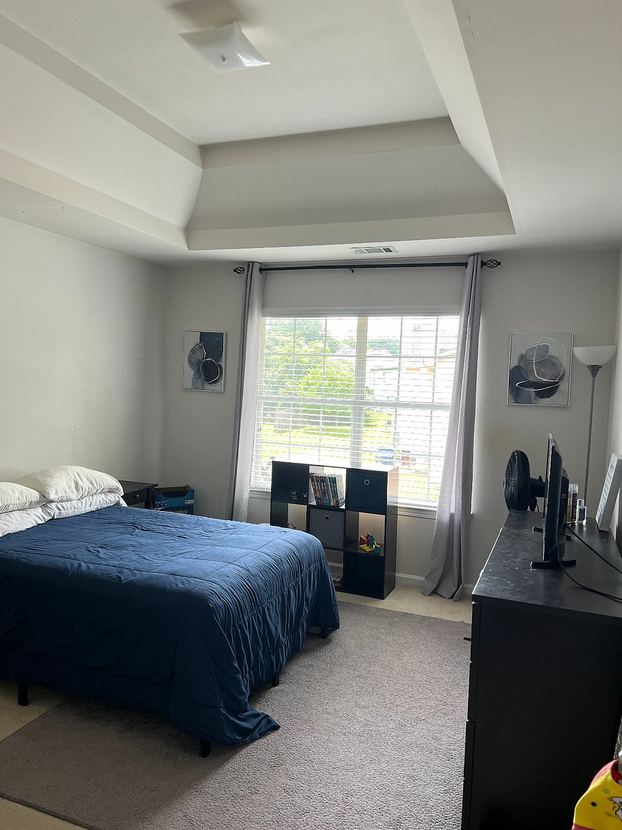 Second-Floor bedroom with gaming desk and tv 