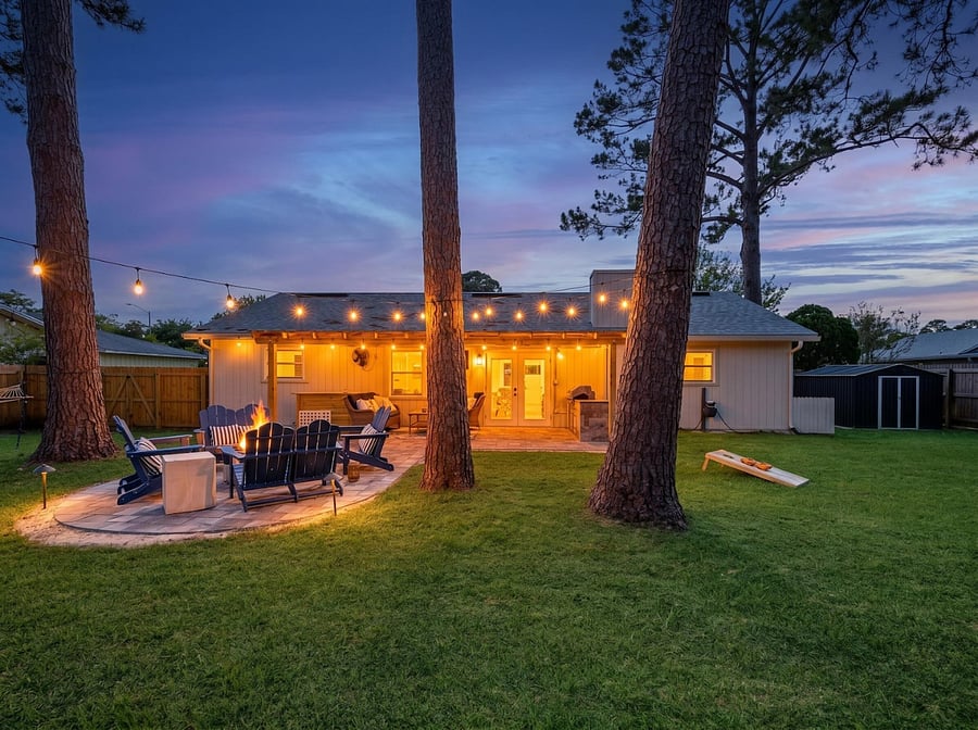 Step outside to your own private, fully fenced backyard retreat, designed for both relaxation and recreation.  Unwind in the hammock, gather around the fire pit, enjoy outdoor games, or relax in the covered sitting area with a TV and fan.