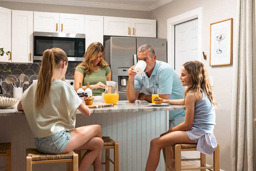 The breakfast bar offers a convenient gathering space for morning coffee, light meals, and easy conversation.