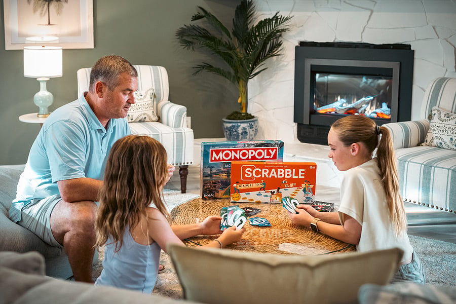 Enjoy an inviting, beautifully appointed evening in the living room, where the fireplace provides an elegant, serene backdrop for game nights or unwinding in the recliner with your favorite shows.