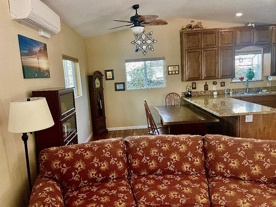 From the front of the TV, you can see grandmother clock, dining room area, ceiling fan. This entire room has lots of outlets with USB capabilities.