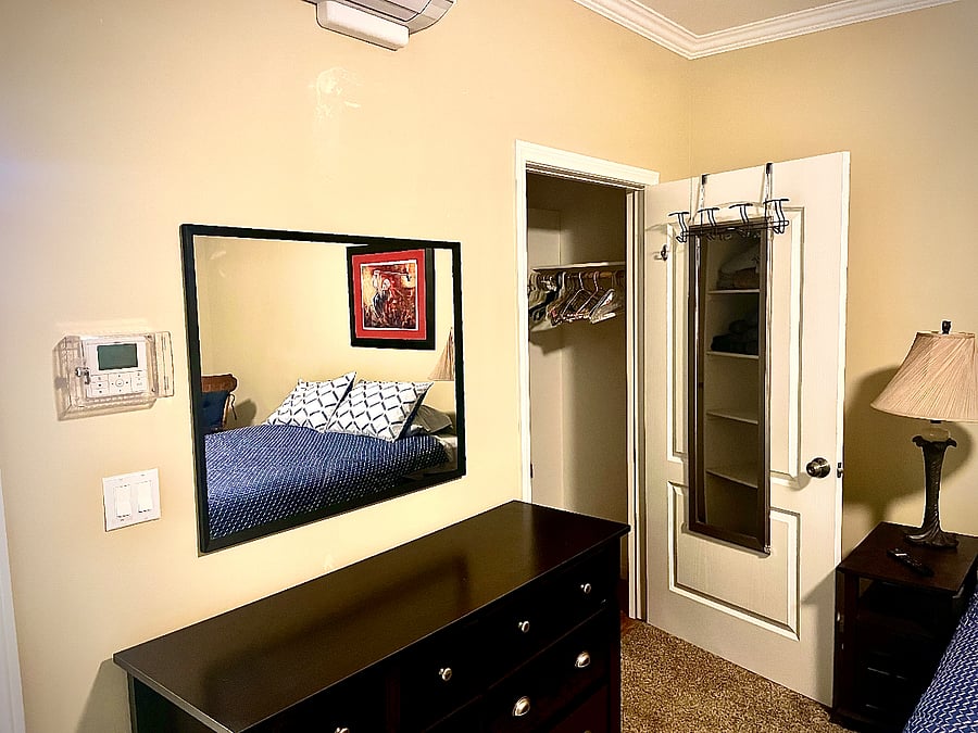 Mirror on dresser and inside door of walk-in closet. You can see the thermostat on the wall in this picture. It is never locked.
Dual wall switch, ceiling fan and light on ceiling fan have separate switches.