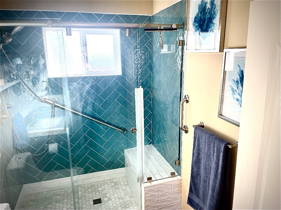Shows built in tiled bench and safety grab bars, Very private and low maintenance bathroom.