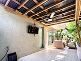 The Covered Patio Includes a Ceiling Fan, Outdoor TV and TRX Mounts for Outdoor Workouts!