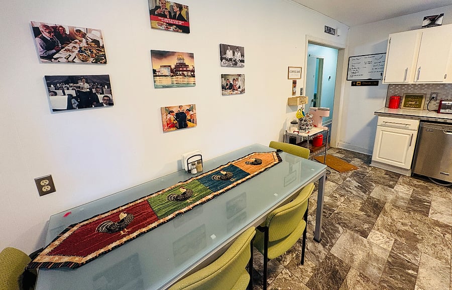 Kitchen table can sit six if pulled out from the wall. Photo collection is airline themed- the old days when a four course meal was served in the sky! 