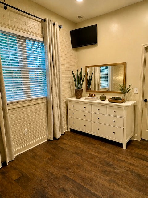 Spacious dresser, black out curtains, woodsy view and smart TV