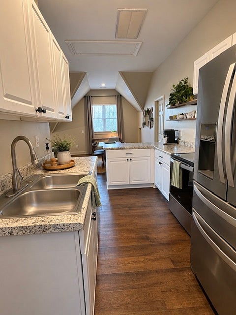 Fully equipped kitchen featuring stainless steel appliances, a full-size refrigerator with ice maker, dishwasher, electric range and oven, microwave, Keurig coffee maker, toaster, cookware, dishes, glassware, utensils, and all the essentials needed to prepare meals during your stay.