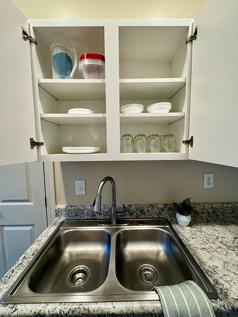 The kitchen is fully stocked with dishes, glassware, coffee mugs, cookware, bakeware, utensils, knives, cutting boards, mixing bowls, measuring cups, and all the essentials needed to cook and dine comfortably during your stay.