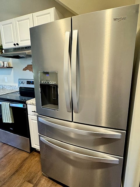 Kitchen:
The modern kitchen features a full-size stainless steel refrigerator with ice maker, ample cabinet storage, generous counter space, and everything you need to prepare meals comfortably during your stay.