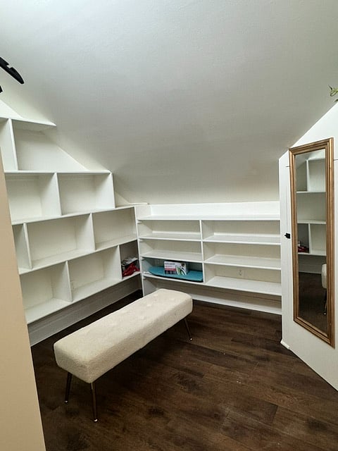 Very spacious walk in closet. Iron, steamer and Ironing board. Floor length mirror. Sitting Bench. Many wooden hangers.