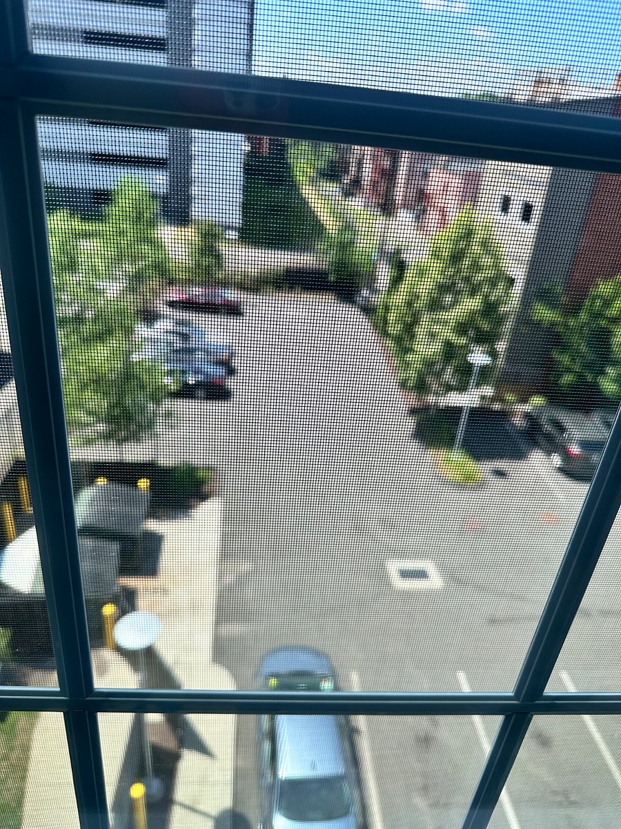 Onsite parking space. View from bedroom window