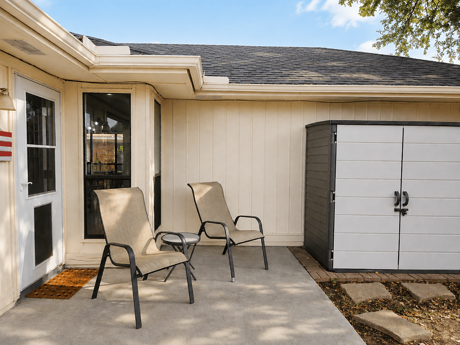 Private quiet  back patio with patio furniture, mature trees, garden shed, doggie door and fenced yard