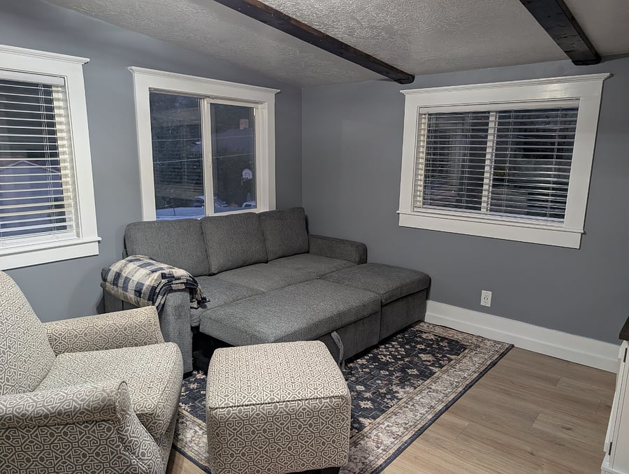 Couch pulls out to a full size bed for guests.
