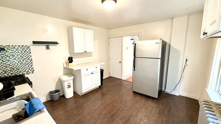 Spacious kitchen with fridge, stove, & microwave