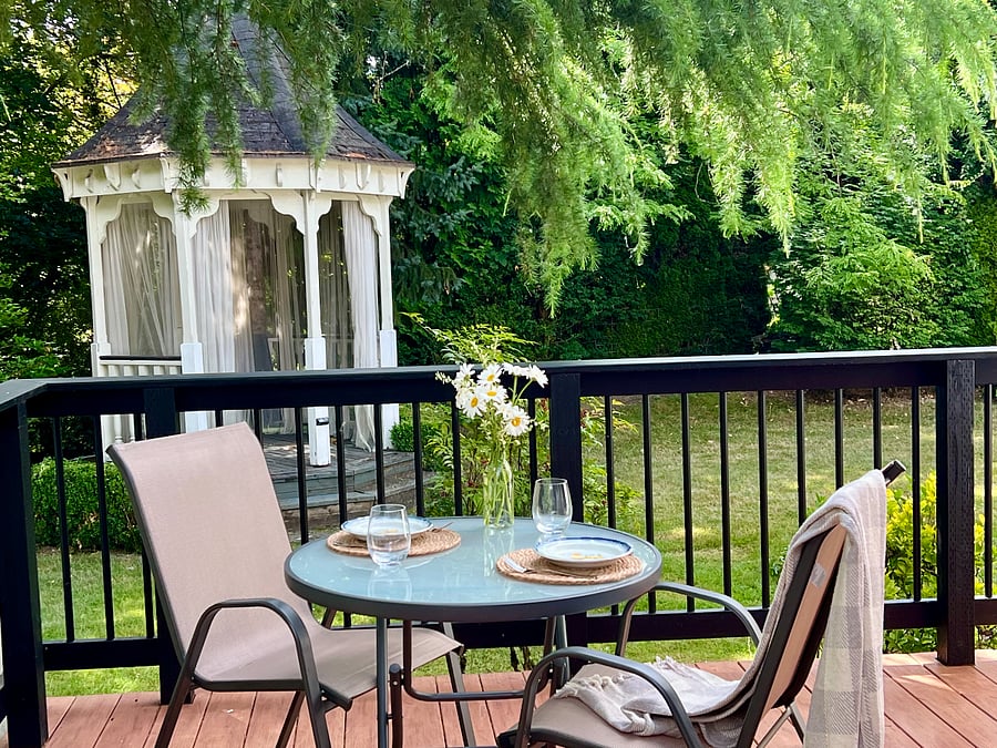 Spacious, private, main-level deck overlooks gazebo, pathways and treehouse