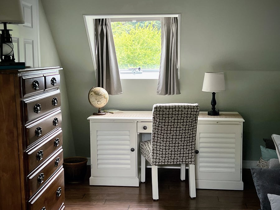 Dedicated workspace upstairs in the main sleeping room with tree-top and balcony views all around
