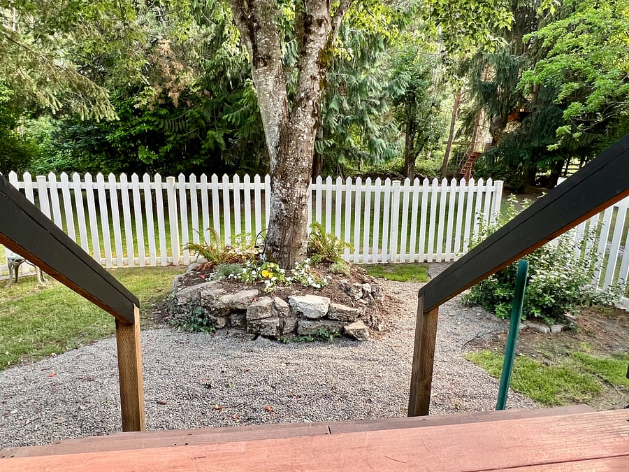 Small grassy pathway yard opens to the gated community park