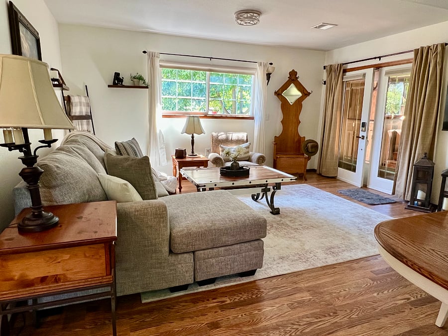 Living room extends to large deck out the french doors.