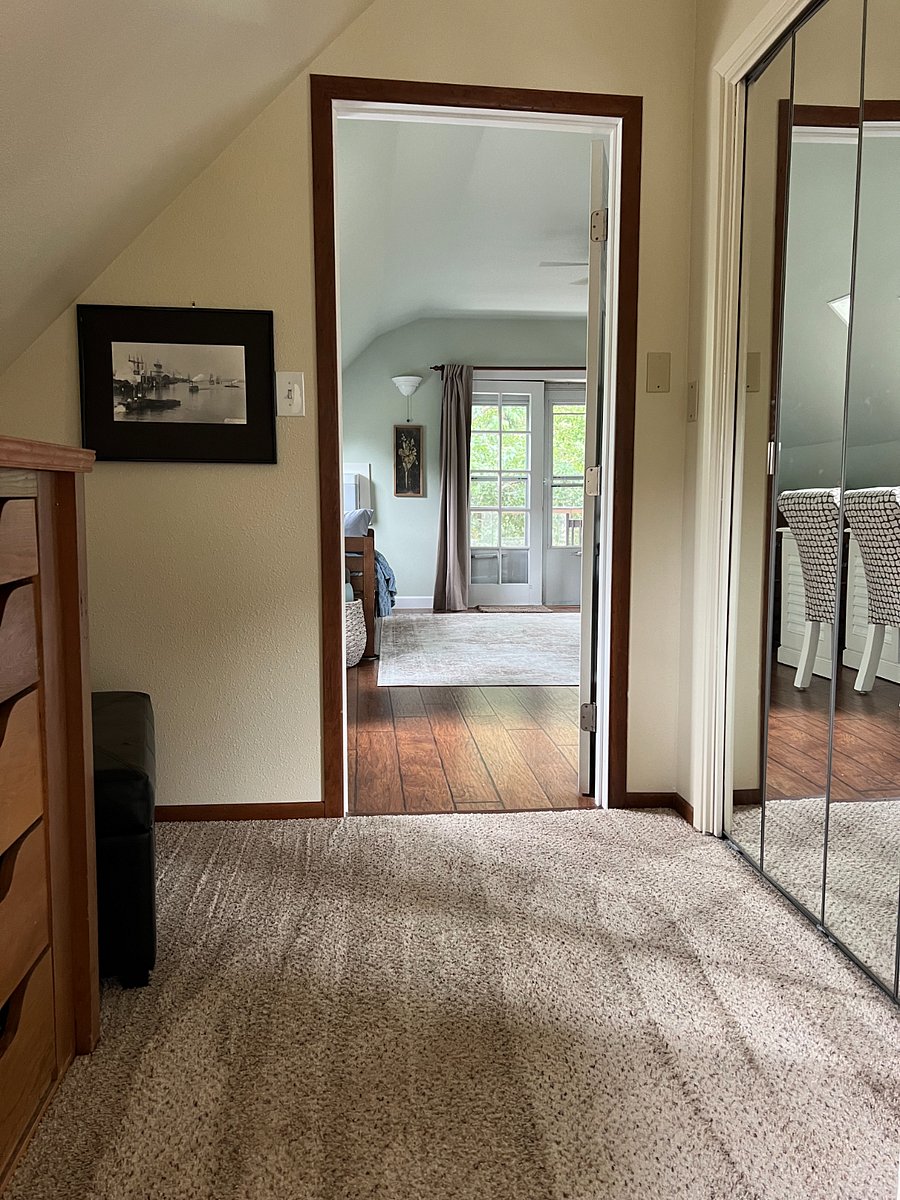 Hall outside of bedroom with large closet for extra storage