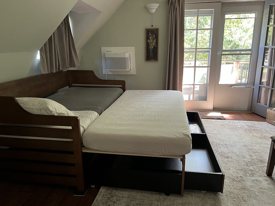 Daybed trundles out to 2 twins/1 king-size bed(s) for the occasional overnight guest or companion travel buddy.