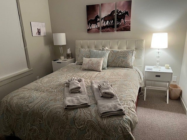 Guest bedroom with ensuite bathroom with sink, toilet, and shower