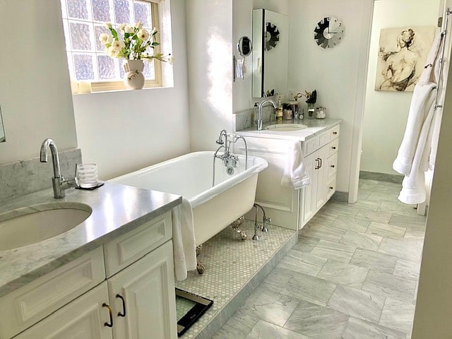 A full bathroom off the master bedroom complete with two sinks, a soaking tub and separate shower