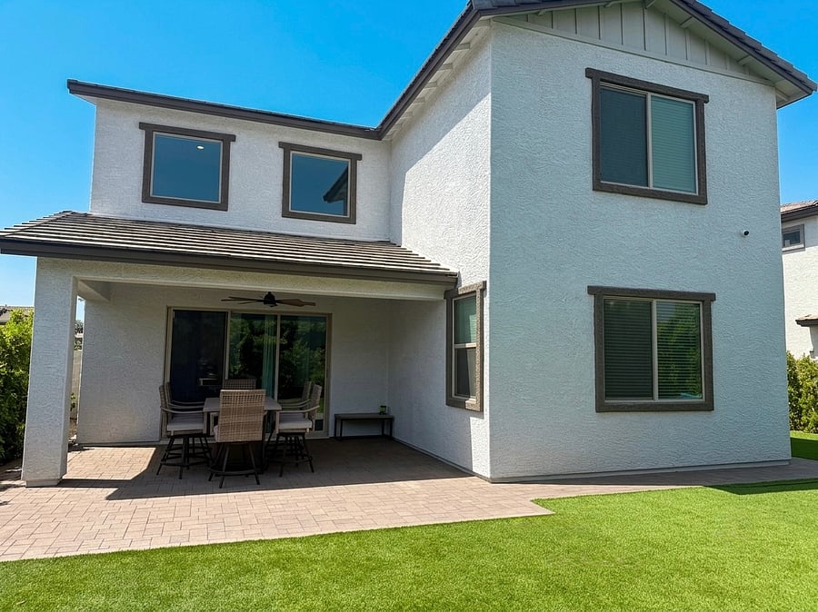 The perfect private oasisfeaturing low-maintenance turf, a 6-seater bar set for entertaining, and a lush wall of ficus trees for ultimate privacy.