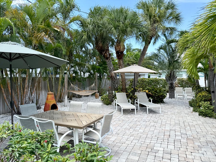 Spaciously furnished private backyard with secure fencing.
