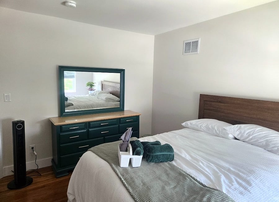 Bedroom 2 - Queen bed, night stand, Large dresser with mirror, wooden desk and walk in closet.