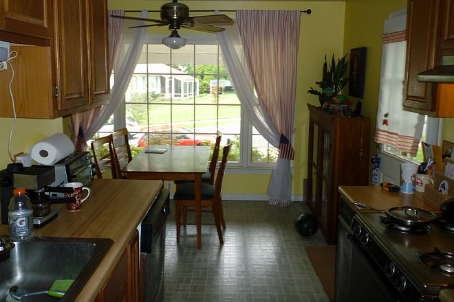 Kitchen looking into front living room looking into backyard
