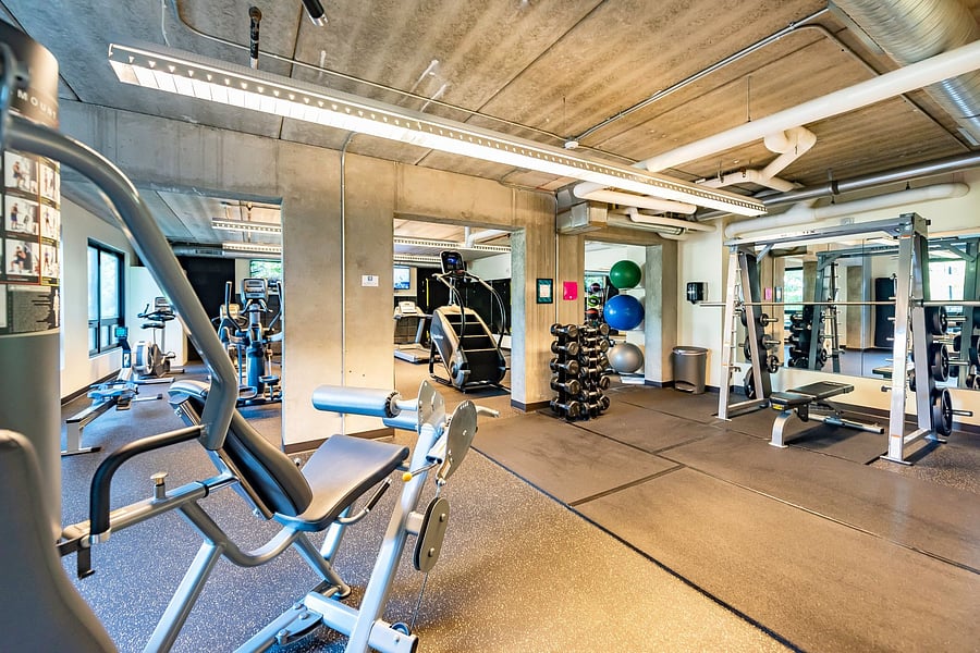Lift or stretch in the building's well-equipped gym