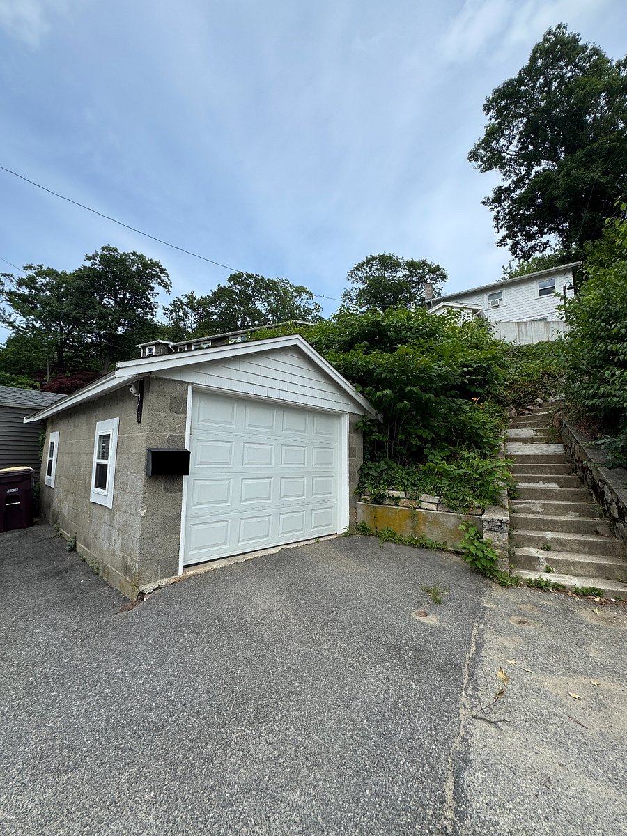 Parking and steps leading up to house