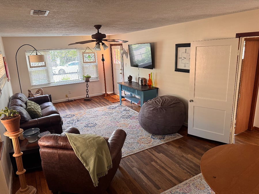 Living room facing the front bay window and street