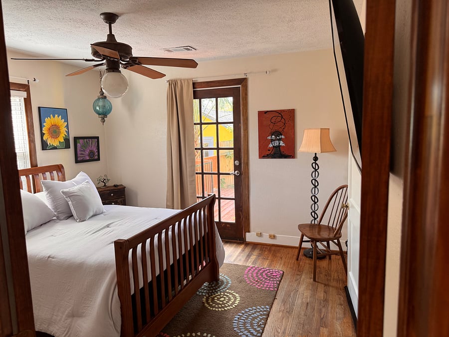Back bedroom has a full sized bed and smart tv.  Private access to back deck.