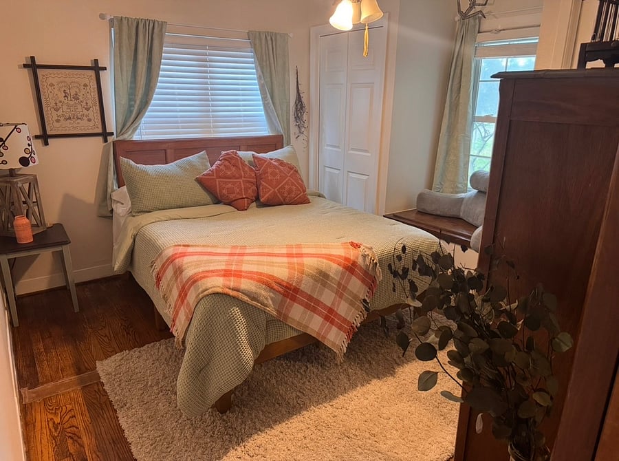 Front bedroom with queen sized bed, double closets and reading nook