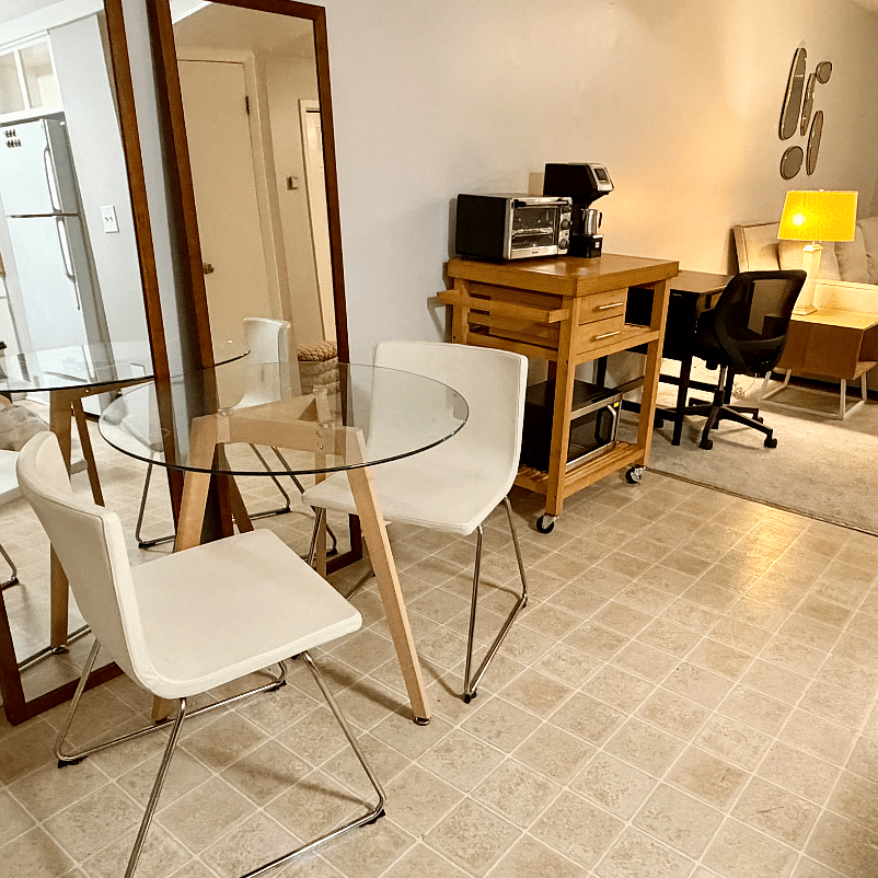 Kitchen dining area and edge of living room/work station