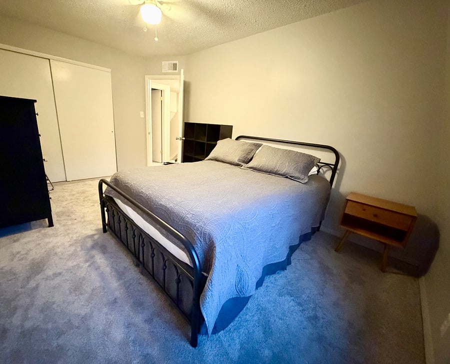 Bedroom #2 with queen bed, view from corner window