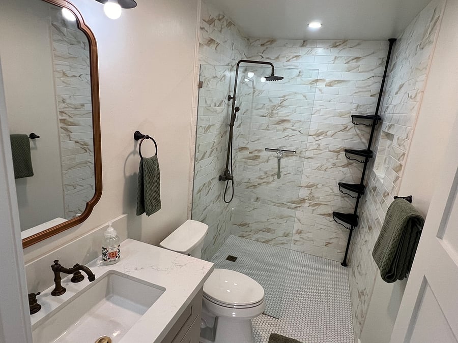 Secondary bath with rain shower and separate body shower nozzle.