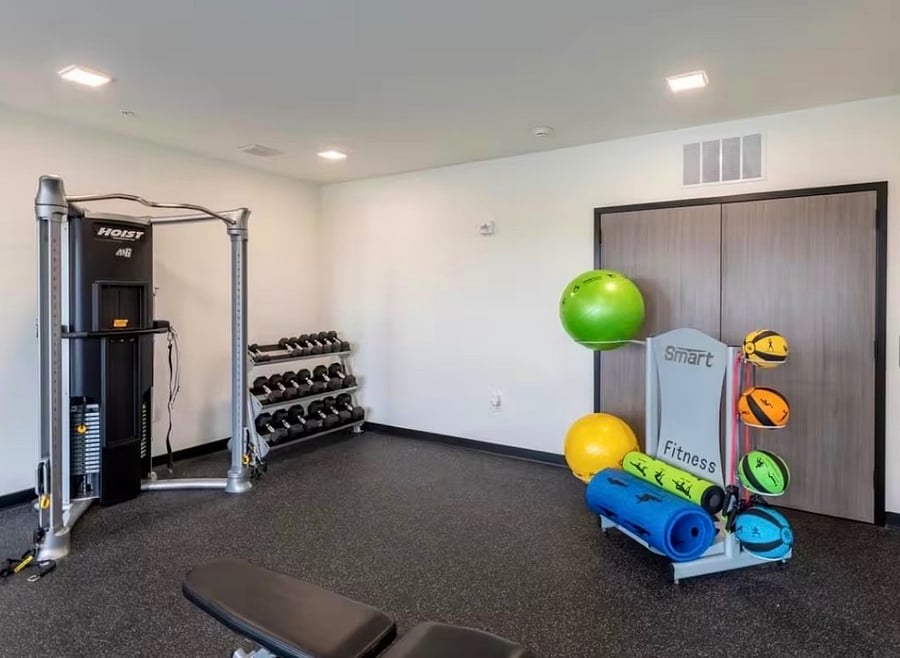 On-site fitness center with cardio and strength equipment no gym membership needed.