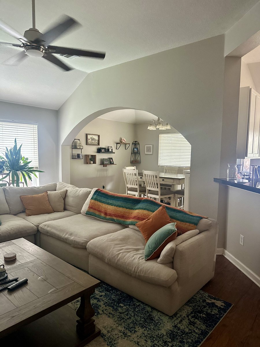 Living Room/Common Area with view into the Dining Room which seats 6.